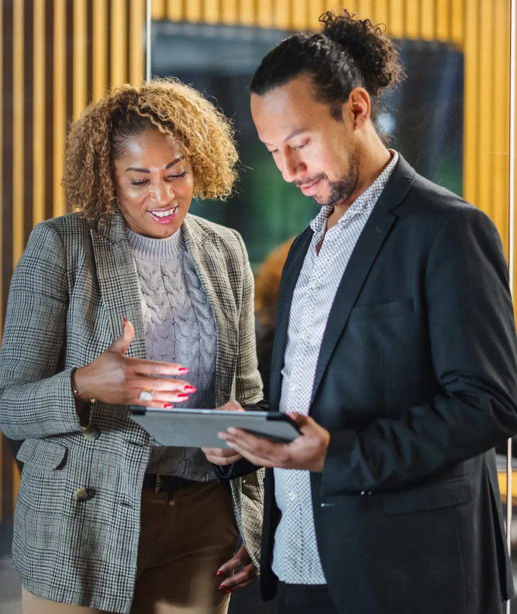 Two professionals reviewing a plan together