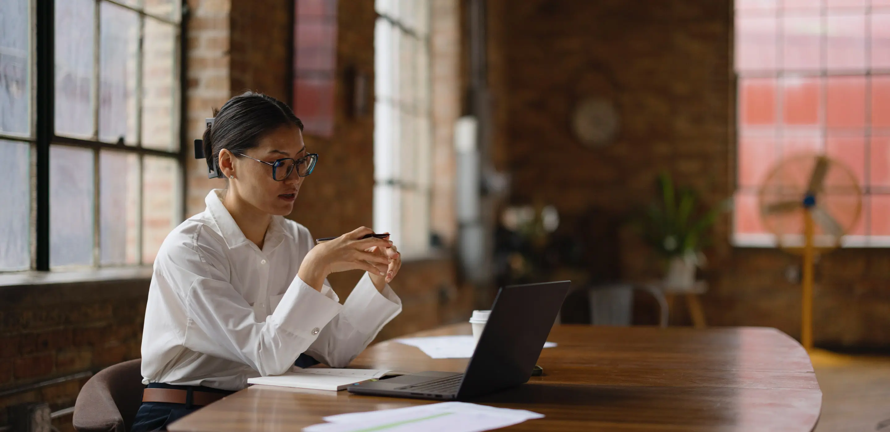 Learner reflecting at a laptop during a digital planning session